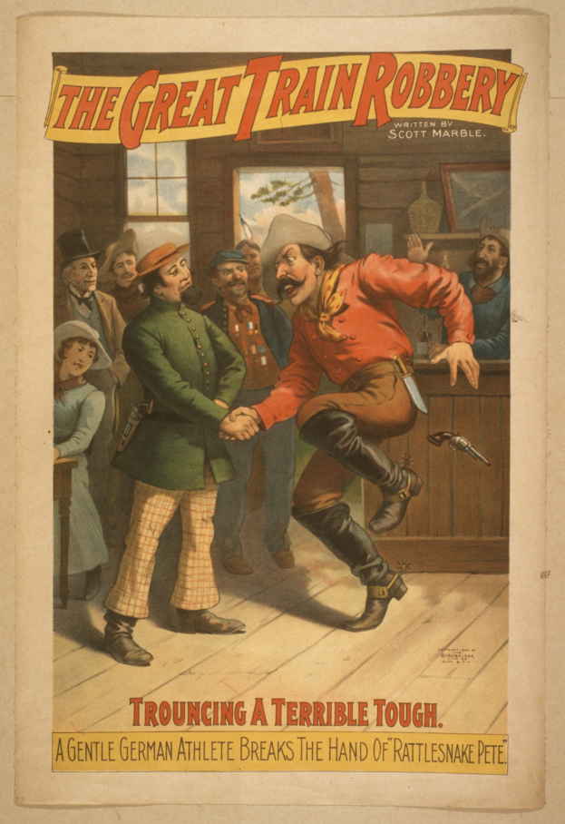 Ein Plakat zeigt eine Gruppe von Menschen auf einem Boden, einer hält eine Waffe, mit Text oben und unten 'Die große Zugüberfall - Trouching ein Schreckliches Tough'.