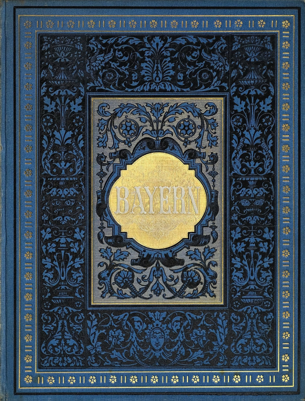 Ein blau-goldenes Buch mit dem Wort "Bayern" auf dem Cover, das mit detailreichen Verzierungen geschmückt ist.